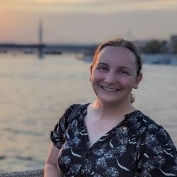 Bethany Malcolm standing on a bridge in Istanbul at sunset