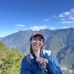 woman posing in front of mountains