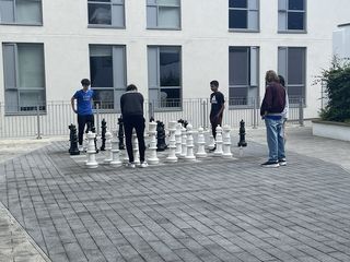 Playing chess in the courtyard of our accommodation.