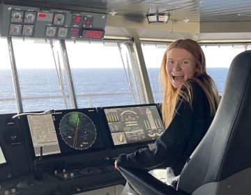 Student in the pilothouse of the ferry