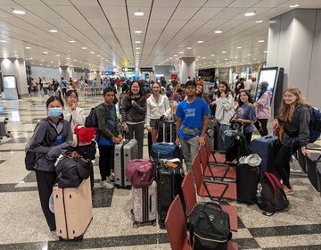 High school students waiting to get on a plane to Singapore