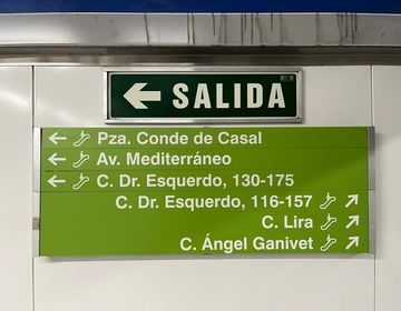 A sign in a metro station showing which way to exit in order to reach various streets
