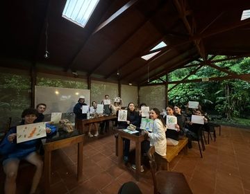 Students had an afternoon of popcorn, drawing and nature. They had to paint a symbiotic relationship that they saw in nature and then name their work of art.