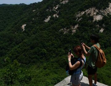 Image of people hiking trails of Bukhansan National Park.