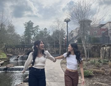 Two friends walking in a park