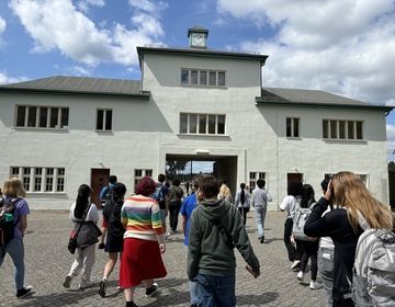 Students headed towards the entrance after arriving from train station