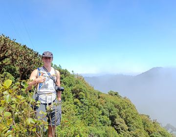 High school student giving a thumbs up at the top of Cloud Forest Mountain