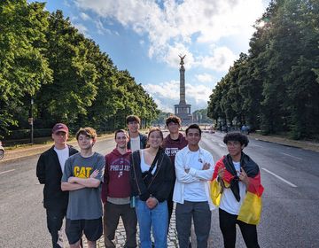 Group of participants with monument behind them in Europe