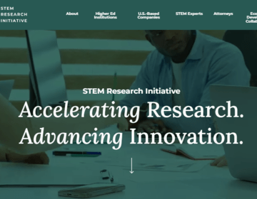 Screenshot of hero image on website of people behind laptop with green overlay and test that says "Accelerating Research, Advancing Innovation"