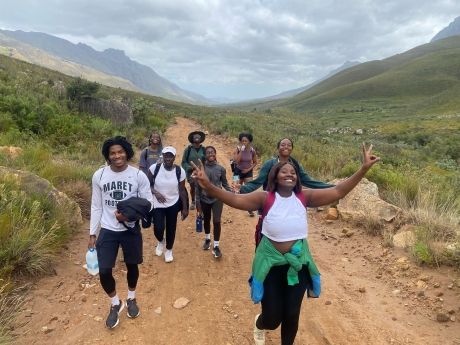 Students hiking on dirt road in Cape Town