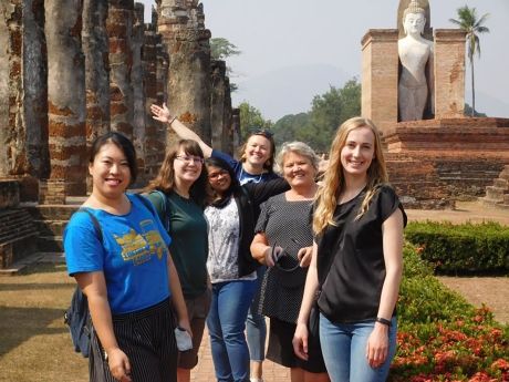 Teach Abroad teacher and coworkers visiting Thai historic site