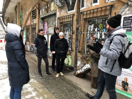 Gap year students looking at street art in Berlin, Germany