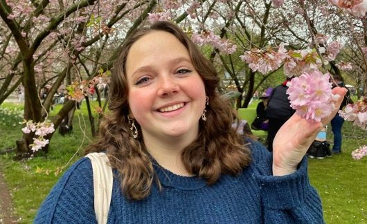 student with pink flower abroad berlin