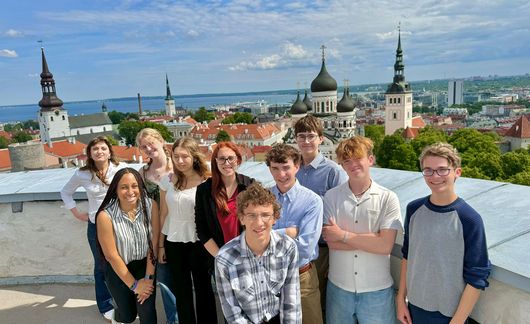 hssa students posing against the tallinn skyline