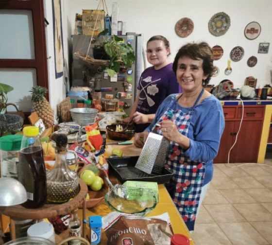 A student cooking with her host mom 