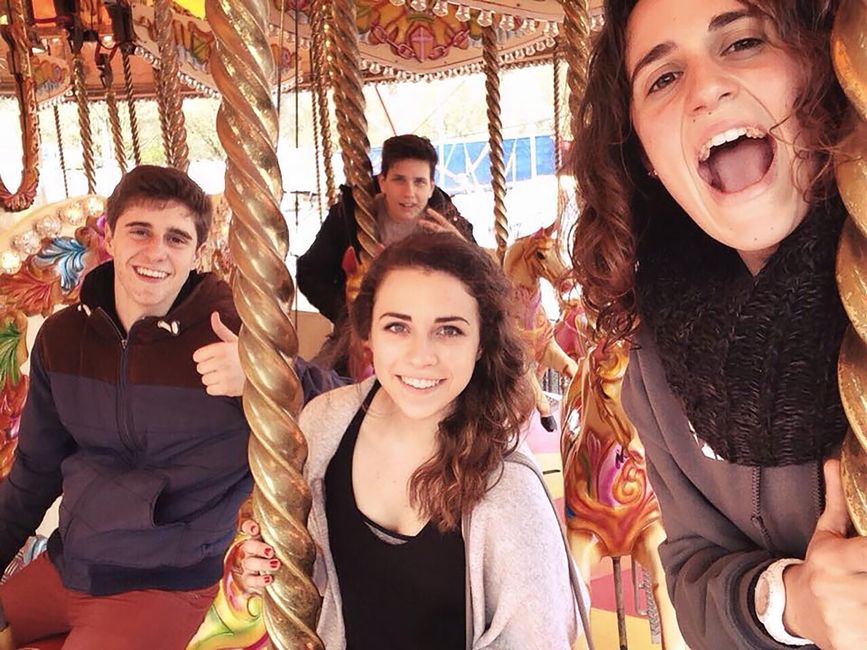 High school students having fun on a carousel at Funderland in Cork, Ireland