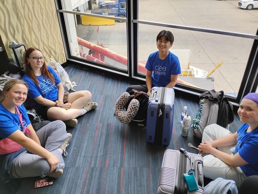 students getting to know each other at the airport