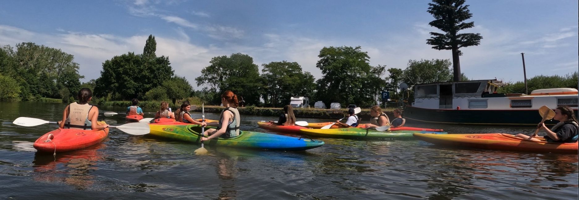 Kids kayaking on a river