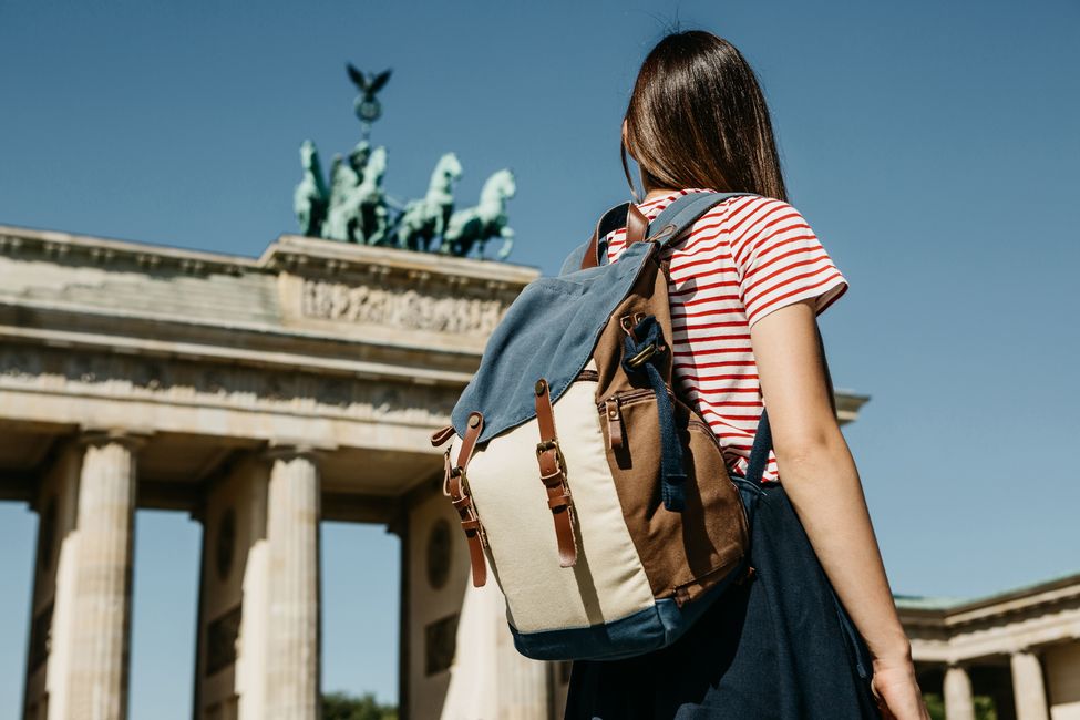 Student looking at Brandenburg Gate in Berlin