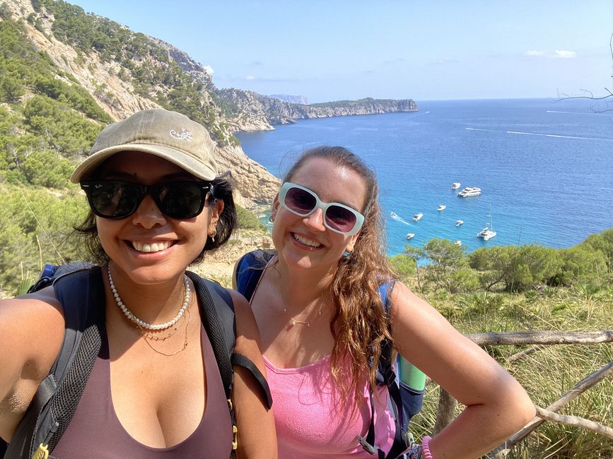 Students smiling by the ocean on a camping trip in Spain