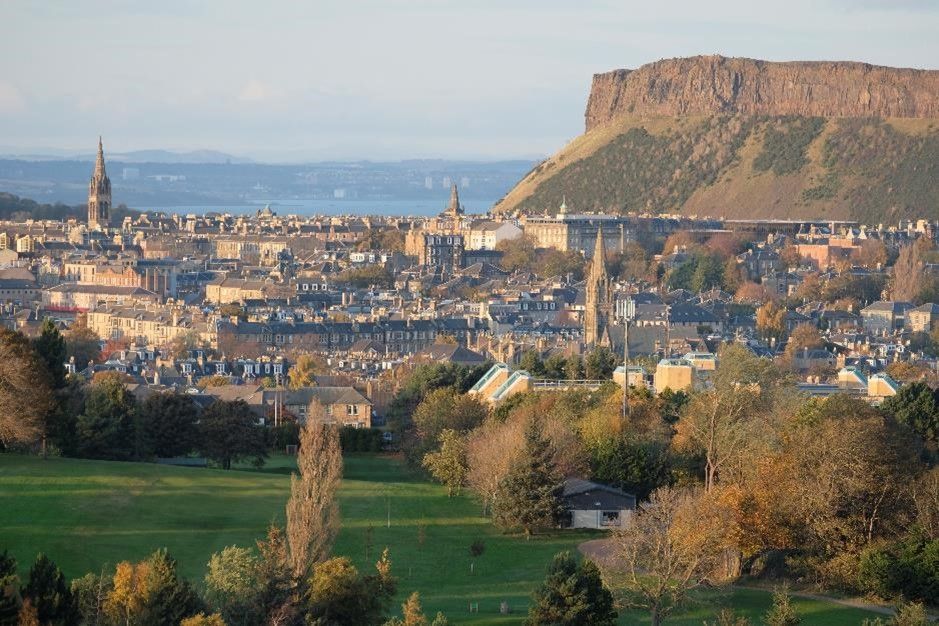 An image of Athurs Seat in the distance 