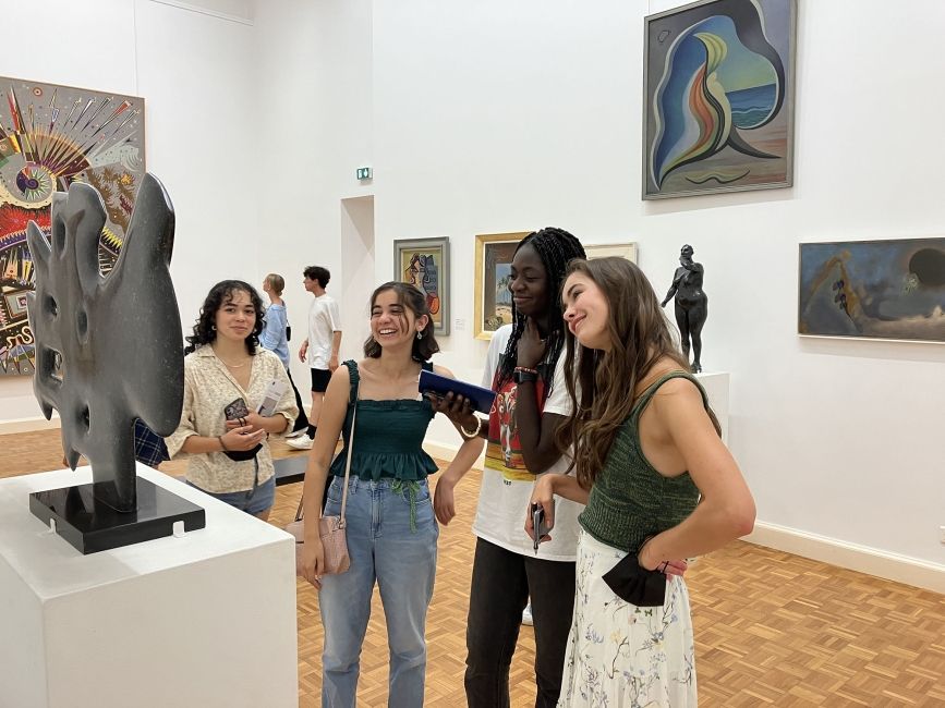 High school students looking at art in French museum