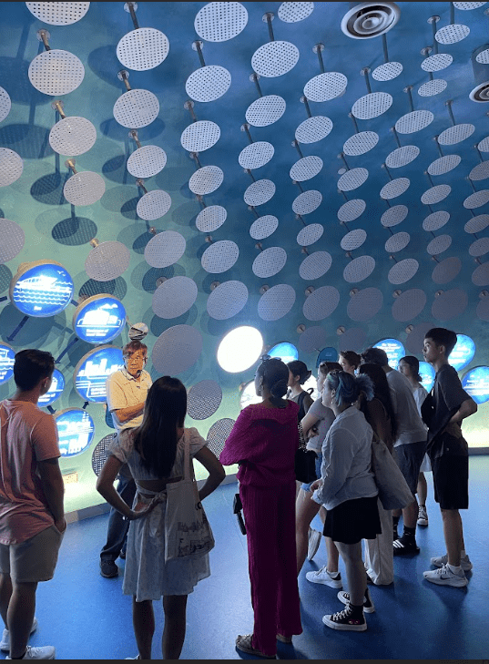 Students learning about sustainable efforts in Singapore at the Marina Barrage.