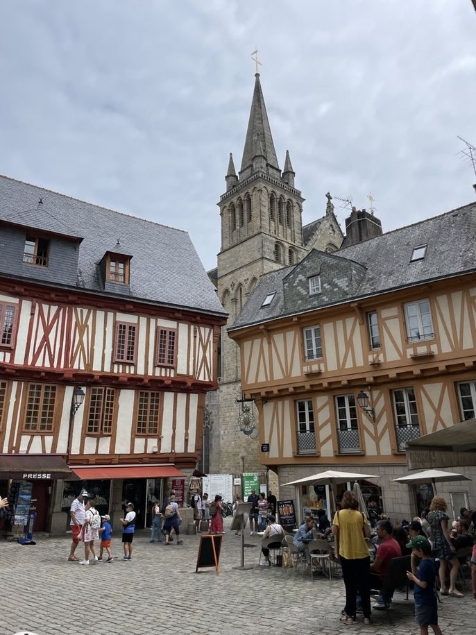 Half-timbered houses with a church in the background