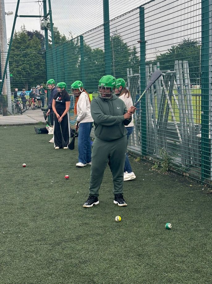 Student Aaron practicing hurling