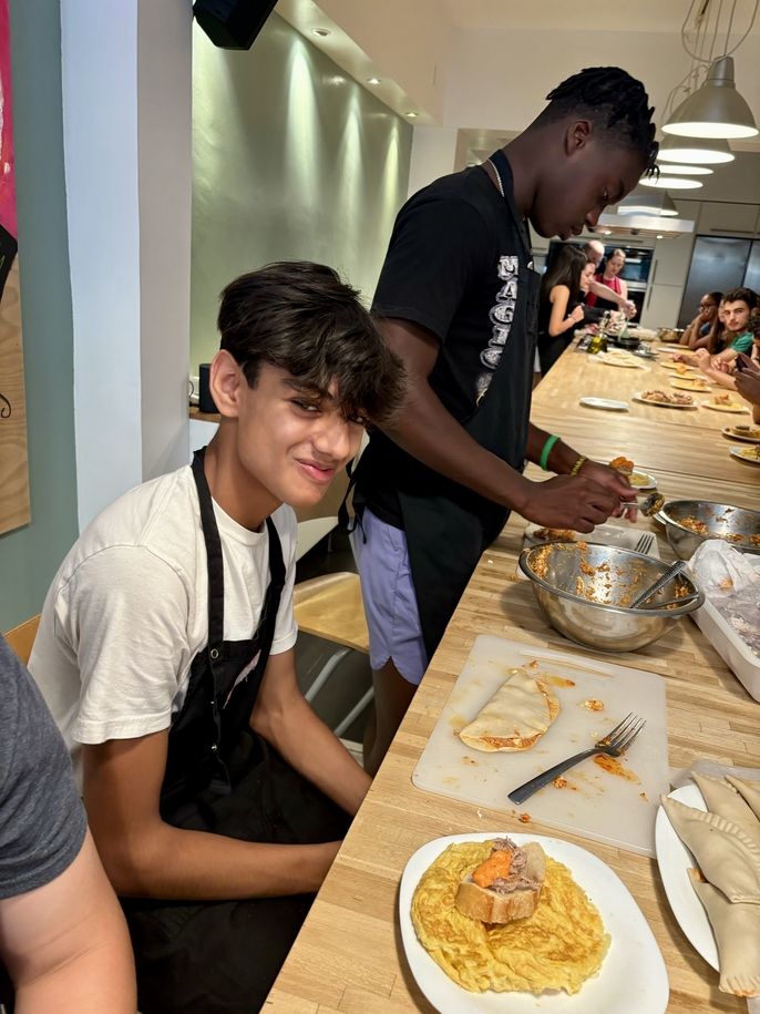 Student shows a finished empanada 