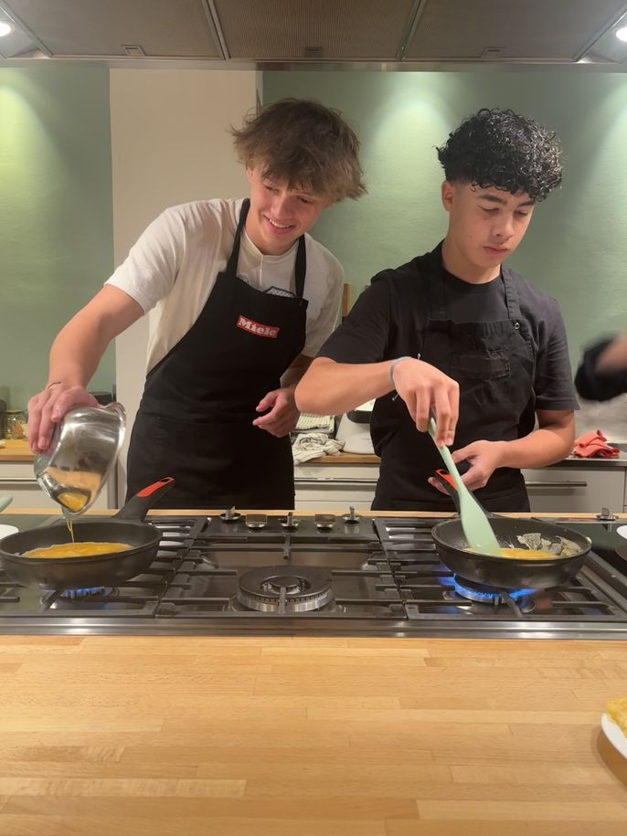 Boys cook their tortillas