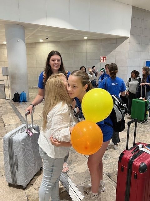 Two Spanish kisses as a greeting at the Alicante airport 