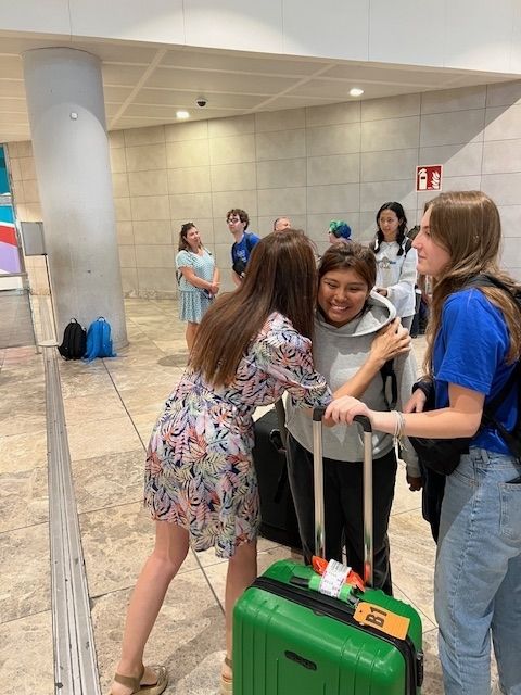 Two Spanish kisses as a greeting at the Alicante airport 