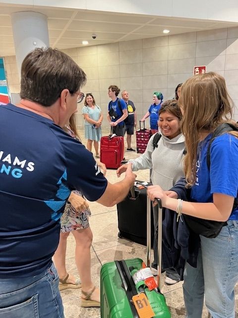 Students greeting their host family in Alicante airport 