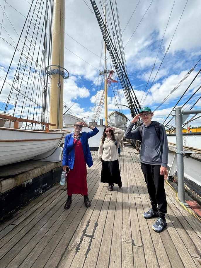 Three students on a boat