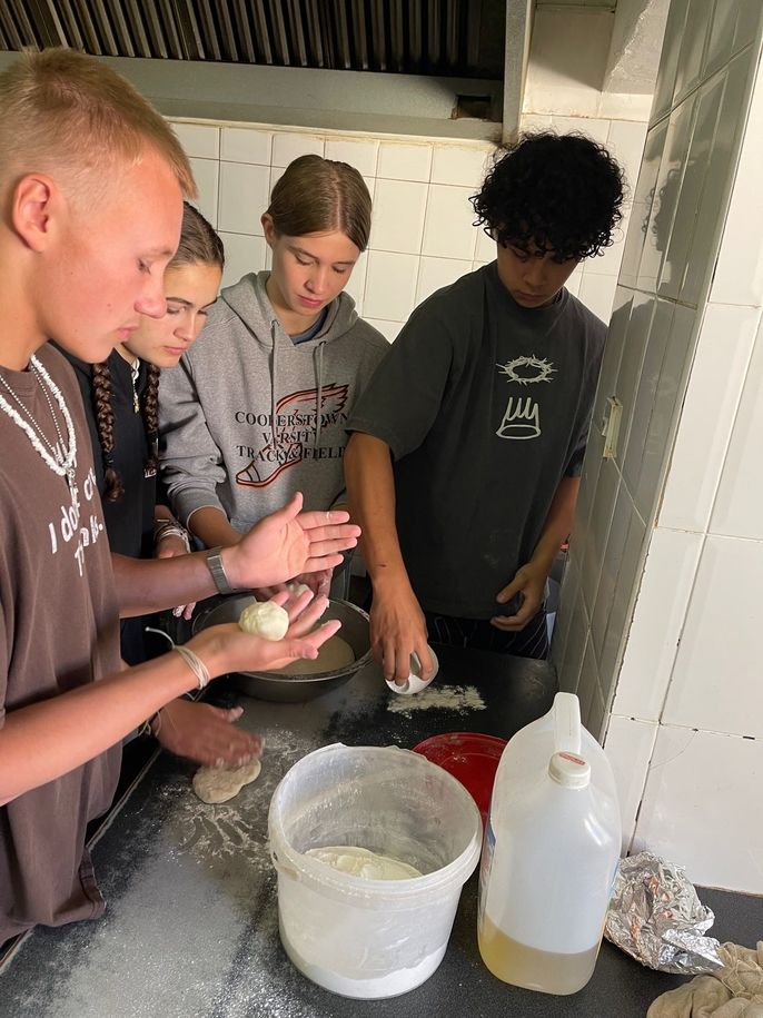 Students making fat cakes.