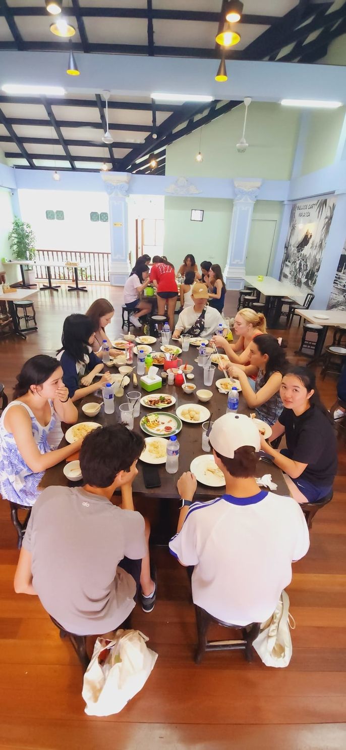 Students eat Malay style Chicken Rice