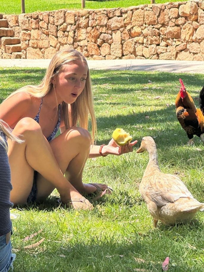 Elizabeth and the duck who wants to share her lunch