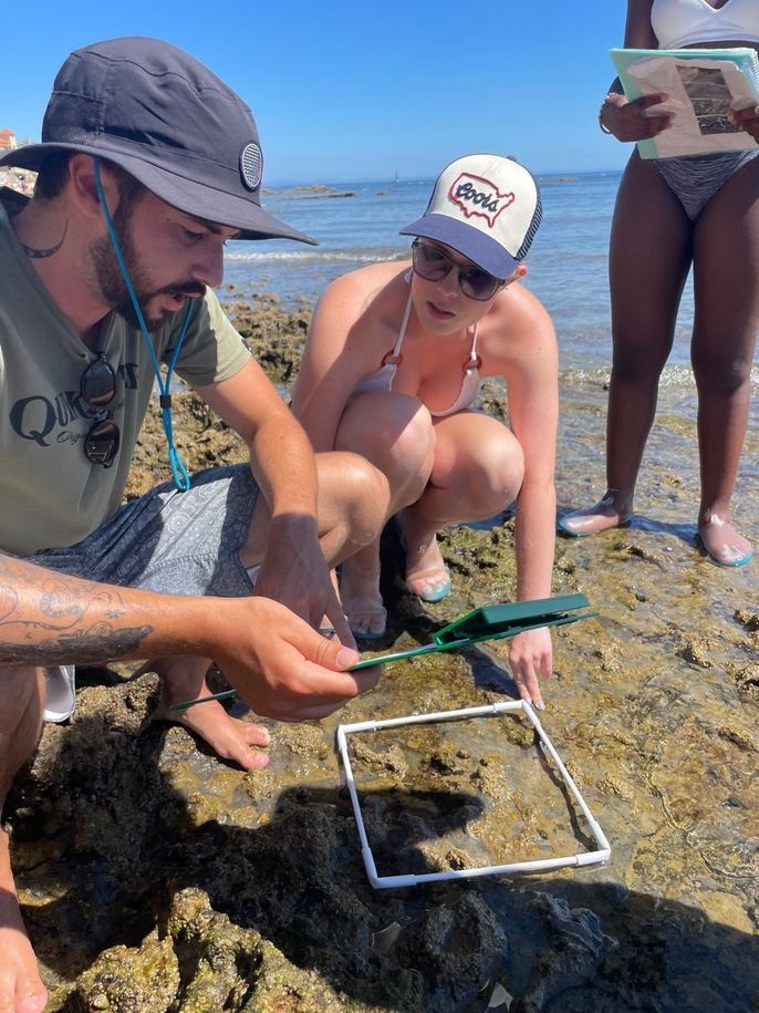 Instructor, Gus, and Margaret gathering their sample