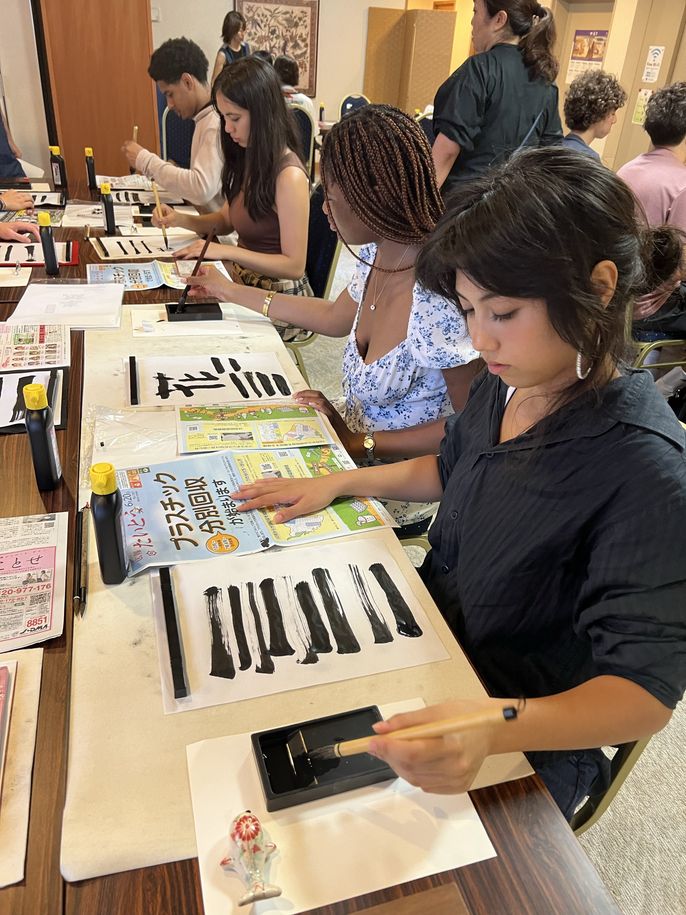 Students practicing shodo strokes