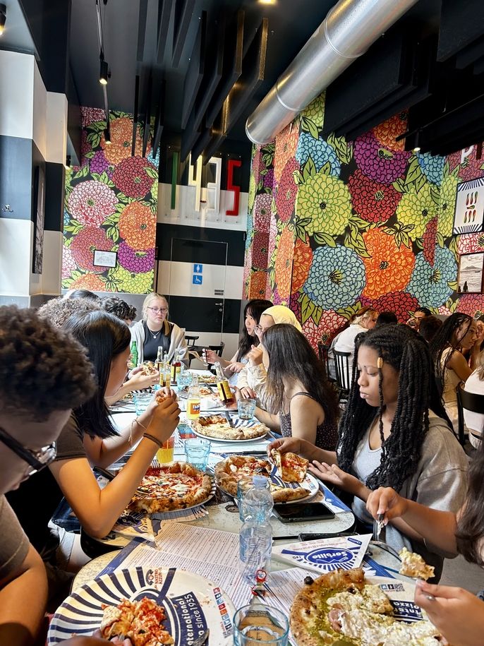 Students eating pizza