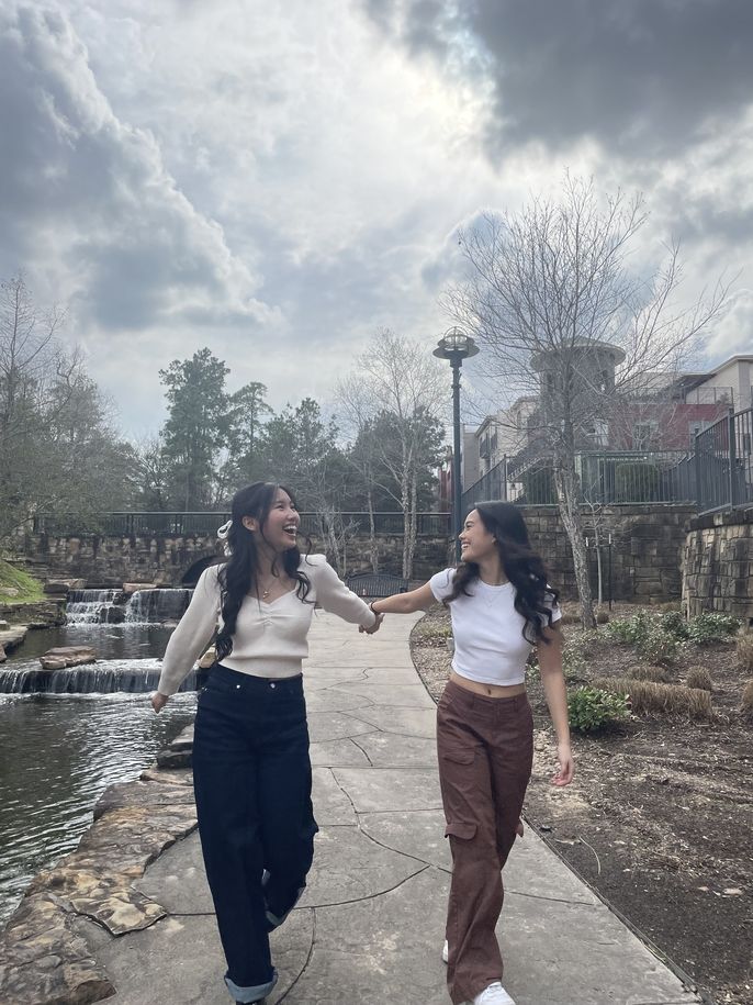 Two friends walking in a park