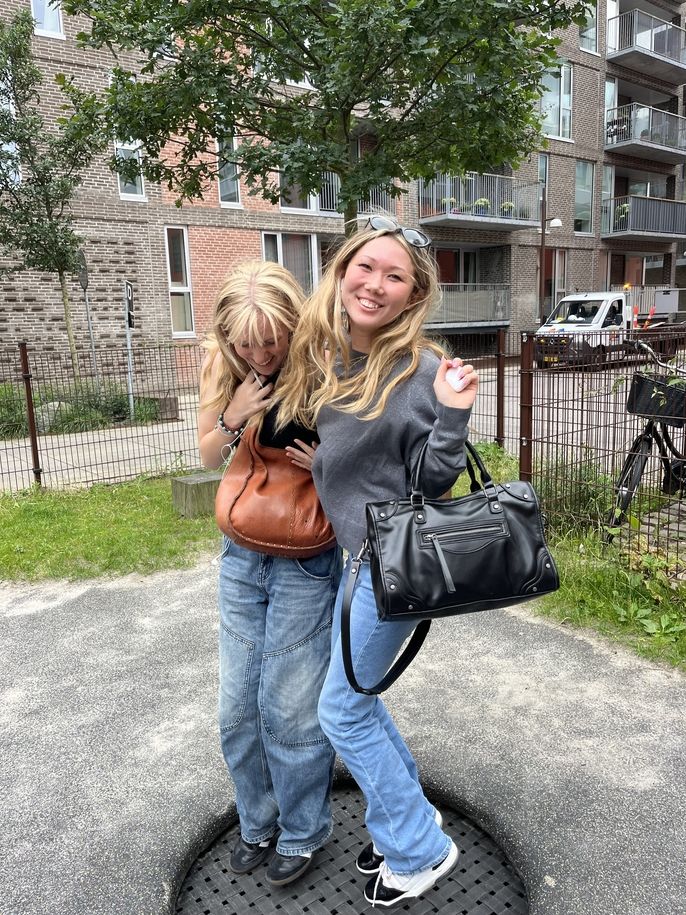 Two students jumping on a trampoline in Nørrebro.