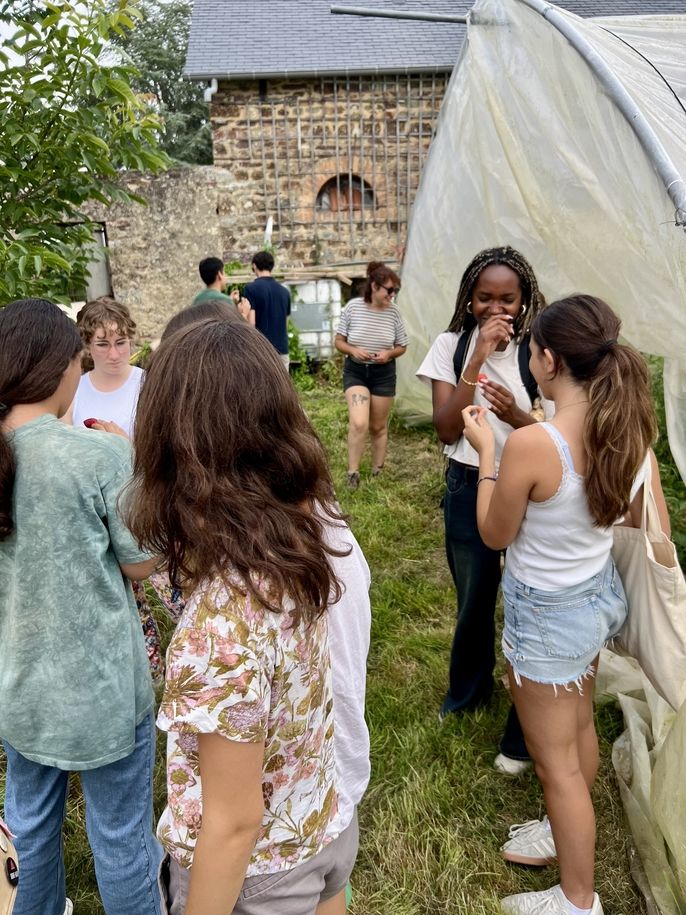 teens trying fresh strawberries and herbs