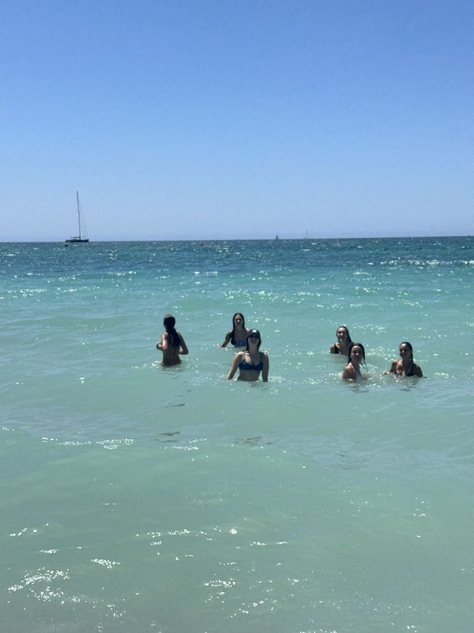 A group of students swimming in the water 