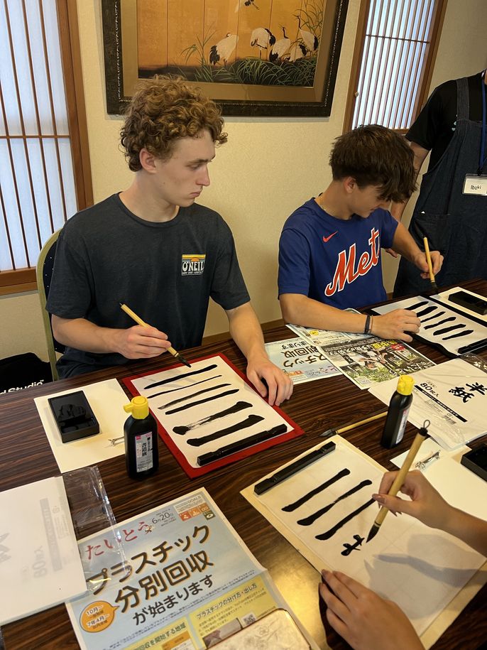 students practicing Shodo brush strokes