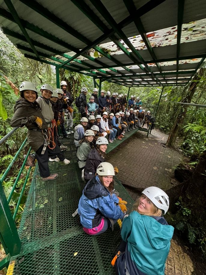 Girls getting instructions for ziplining