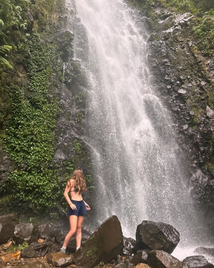 Ella in front of waterfall