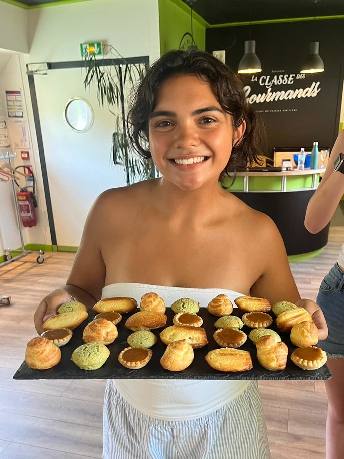 Student with a variety of baked goods