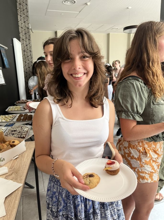 Student with desserts